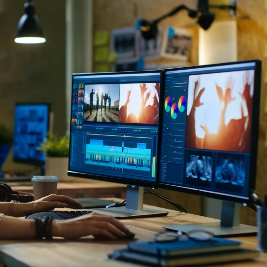 Beautiful Female Video Editor Works with Footage on Her Personal Beautiful Female Video Editor Works with Footage on Her Personal Computer, She Works in Creative Office Studio.